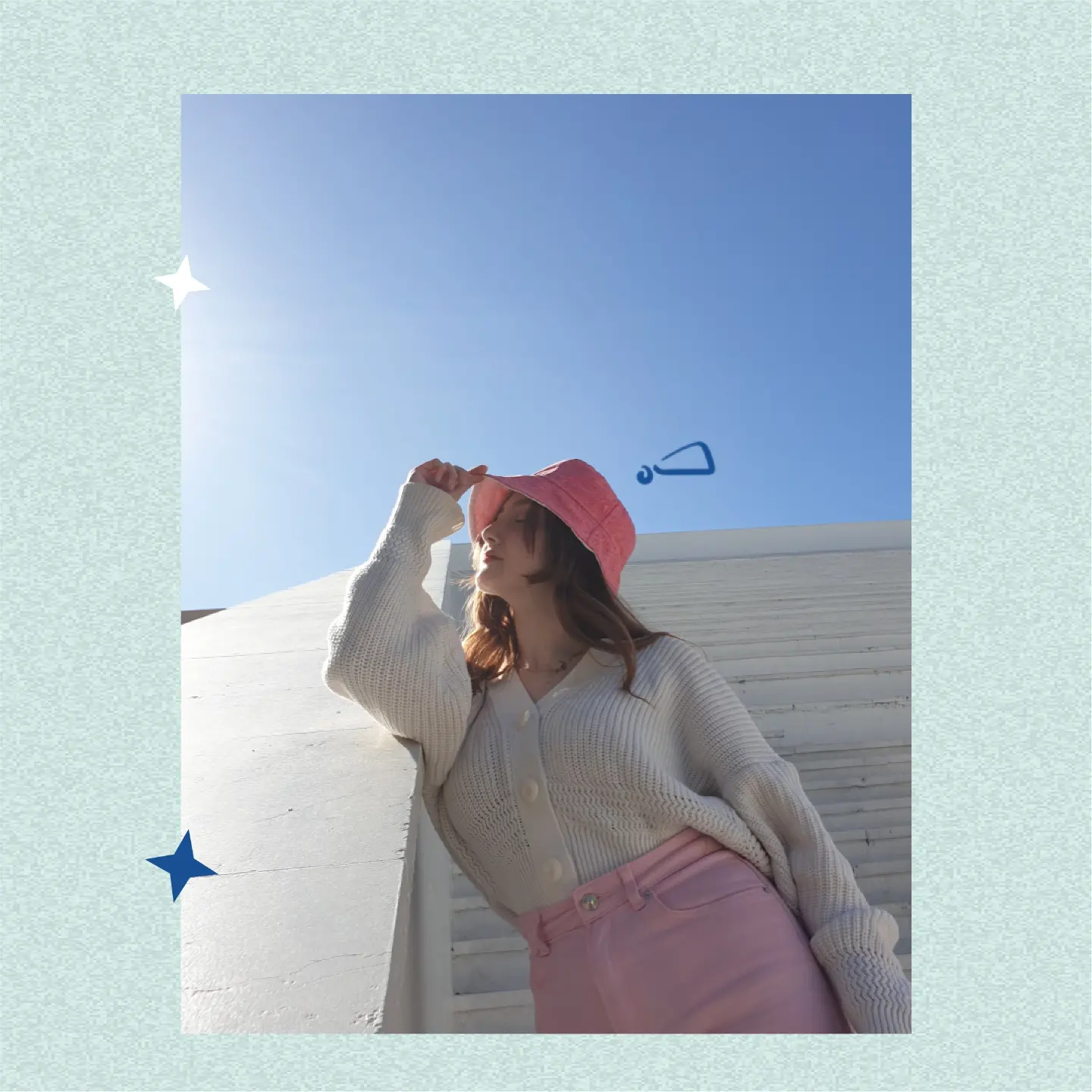 pink bucket hat against the sky